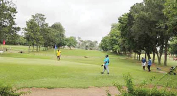 Golfers In Action On The Lush Greens Of Ikoyi Clubs Golf Course